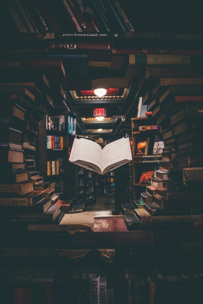 Printed books arranged on a desk representing paperback layout and formatting